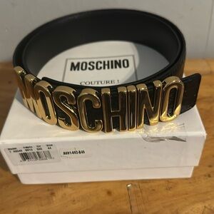 Moschino women gold buckle belt. Moschino logo in gold